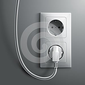 Electric white plug and socket on grey wall