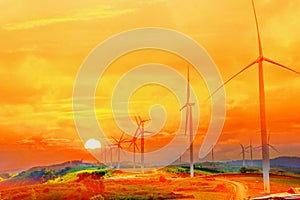 Electric wind turbine plant on mountain with sun set multi color sky abstract nature background