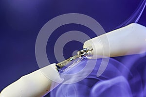 electric wire and smoke is meant to symbolize blown insulation or overheating