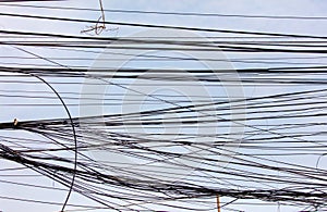Electric wires against the sky as an abstract background