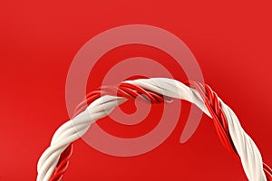 Electric wires on red background, closeup view