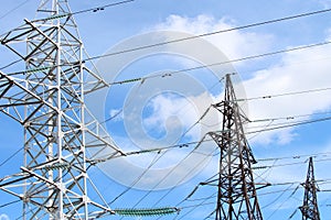 Electric wires on steel poles. High voltage power line. The concept of industrial ecology