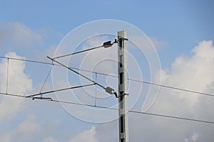 Electric wiring of trains with sky background in daylight