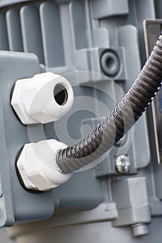 Electrical box with connected cable. Detail and part of electric engine or industrial machinery