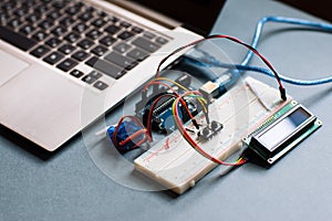 Electrical breadboard connected to computer