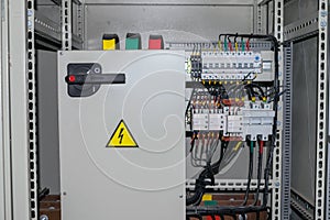 Electrical cabinet containing a plurality of contacts and switches photo
