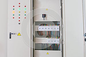 The electrical cabinet has a lot of bright buttons and switches