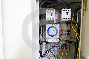 Electrical cabinet timer used to power large electrical equipment.