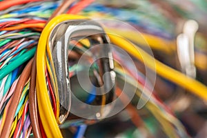 Electrical cable on hook of organizer, macro view with blurred background