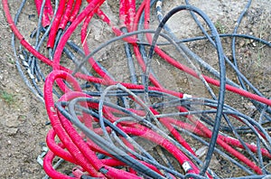 Electrical cables and Red plastic pipes