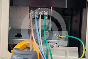 Electrical cables with terminal block . electrical wires is connected to clamps in power system of direct voltage