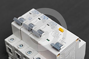 Electrical circuit breakers on a gray background, close-up. Designed for switching electrical circuits and their