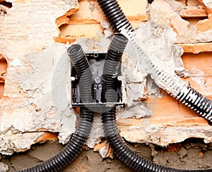 Electrical coil conduit pipe on box embedded in wall