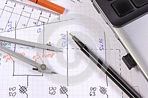 Electrical construction diagrams, accessories for drawing and laptop. Engineering jobs concept