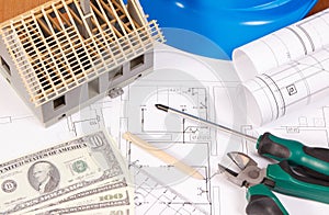 Electrical construction drawings, work tools and accessories, small house and currencies dollar, building home cost concept