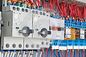 In the electrical control panel are circuit breakers protecting the motor and relay.