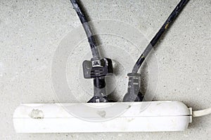 Electrical cords connected to power strip building site