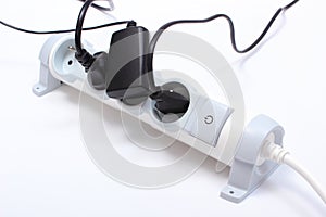 Electrical cords connected to power strip, concept of energy saving