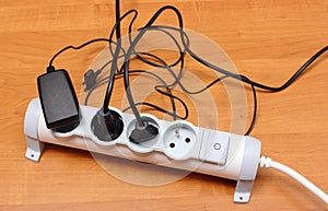 Electrical cords connected to power strip, energy saving