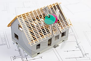 Electrical drawings, diagrams and house under construction with home keys, building home concept