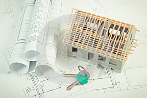 Electrical drawings, home keys and small house under construction