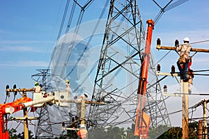 electrical engineer check planning with group of electric worker working on pole connected high voltage wires