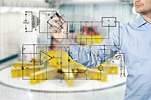 Electrical engineer draws a diagram of a circuit