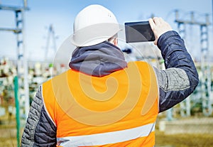 Electrical engineer filmed with tablet PC