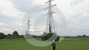 Electrical engineer servicing electricity pylons.