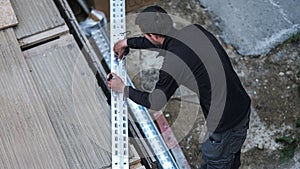 An electrical engineer from the team cut chutes that will serve as support for the electrical cabling of the installation of