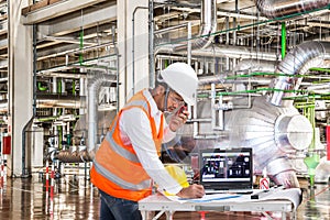 Electrical engineer working at control room of a modern powerhouse