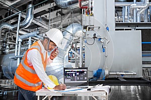 Electrical engineer working at control room of thermal power plant