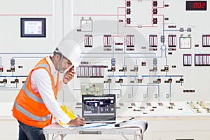 Electrical engineer working at control room of thermal power plant