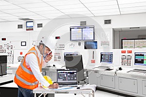 Electrical engineer working at control room of thermal power plant