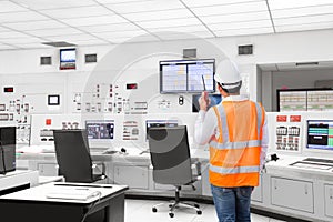 Electrical engineer working at control room of thermal power plant