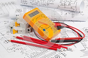 Electrical engineering drawings, circuit breaker, pencils and digital multimeter