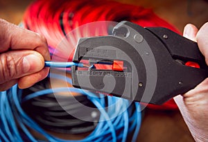 Electrical equipment. Electricity cable and crimper. Background