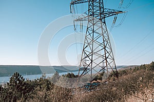 Electrical equipment, high voltage power line insulators on winter sky backdrop.