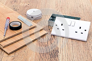 Electrical equipment items and laminate flooring