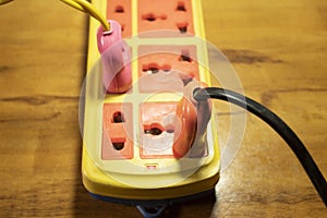 Electrical extension cord with plug in socket