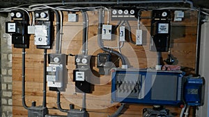 Electrical fuse boxes and power lines in the basement of an old apartment building