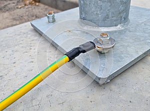 electrical grounding or earthing wire at a zinc-plated steel pole