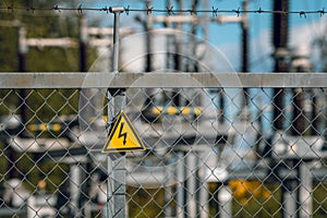 Electrical hazard sign  on a fence of an high-voltage substation