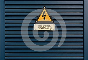 Electrical hazard sign on a triangular yellow sign