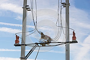 Electrical high voltage fuses on the grey concrete pillars