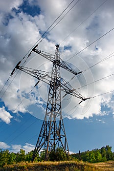 Electrical industry on blue cloudy sky at summertime