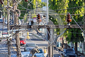 Electrical insulators and wires on poles in Asia