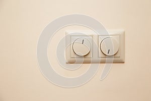 Electrical light dimmer switches on the wall