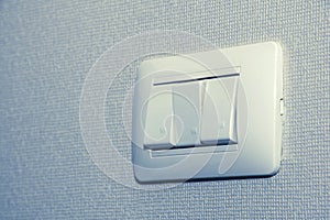 Electrical light switch control with square grid wallpaper