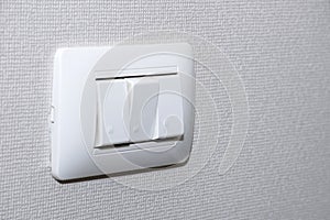 Electrical light switch control with square grid wallpaper